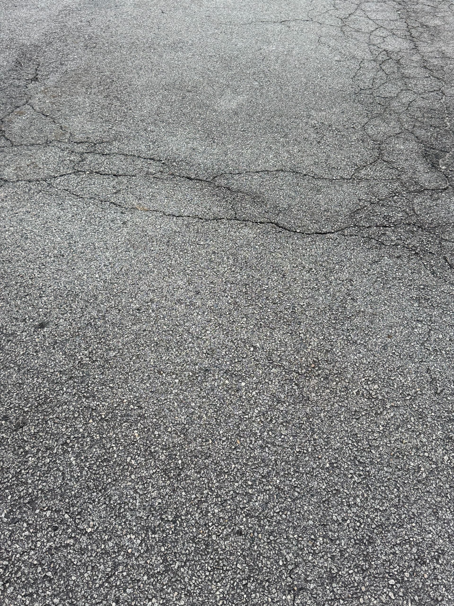 What Fresh Sealcoating Does for a Cracked Atlanta Parking Lot image
