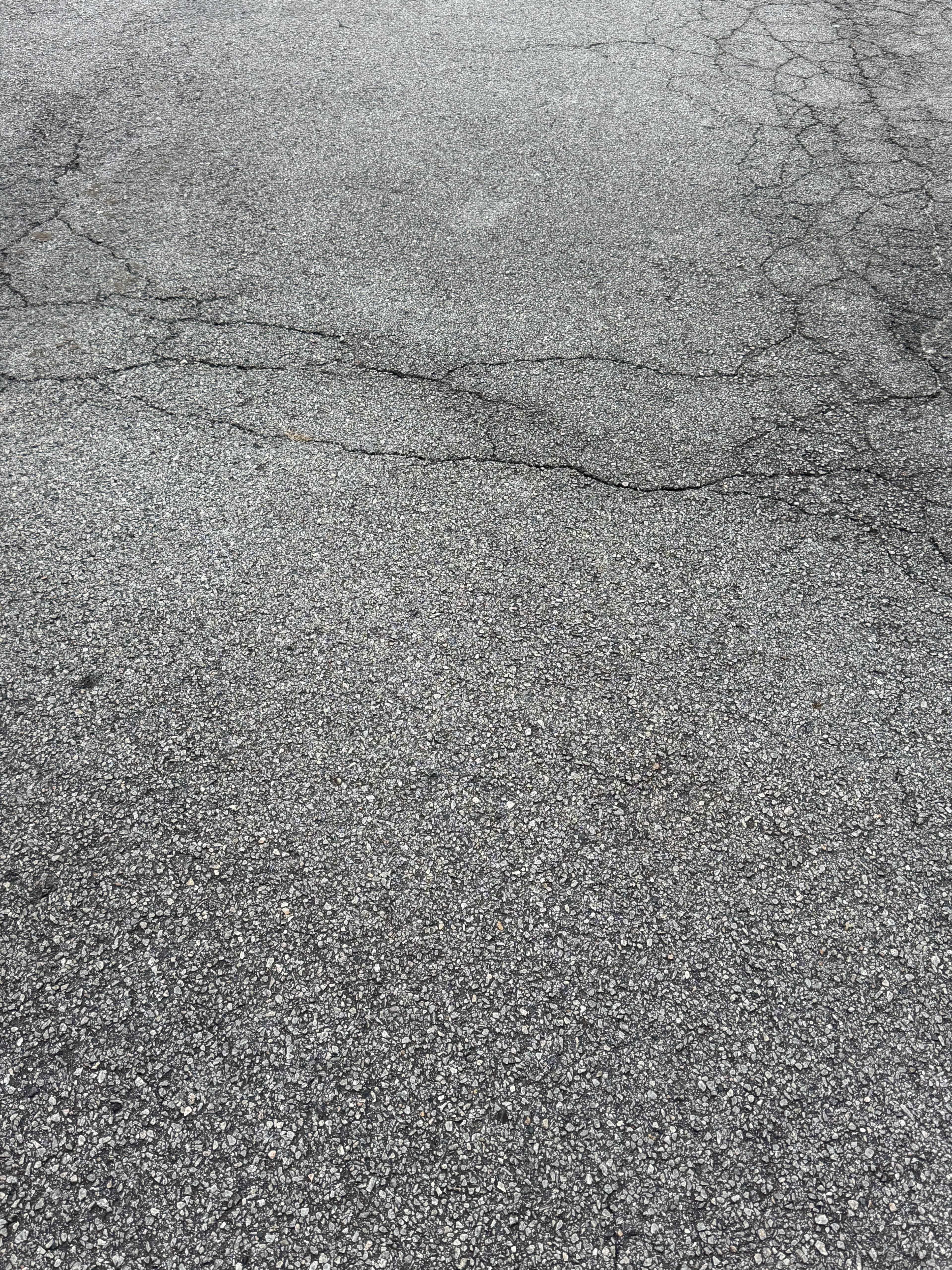 Project What Fresh Sealcoating Does for a Cracked Atlanta Parking Lot image