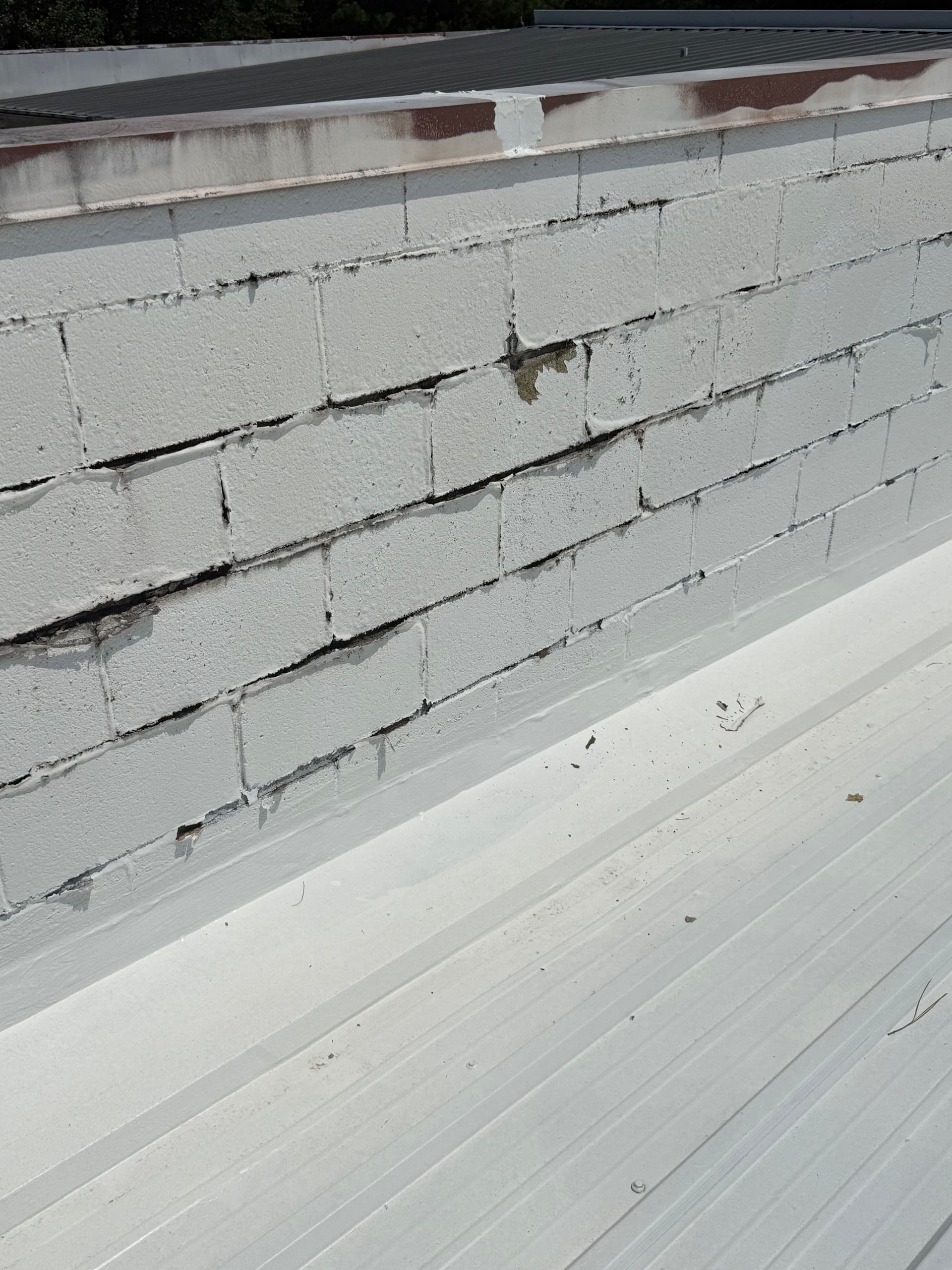 Gallery photos for Why Cracked Parapet Walls Are a Silent Leak Risk on Commercial Roofs: Image #1