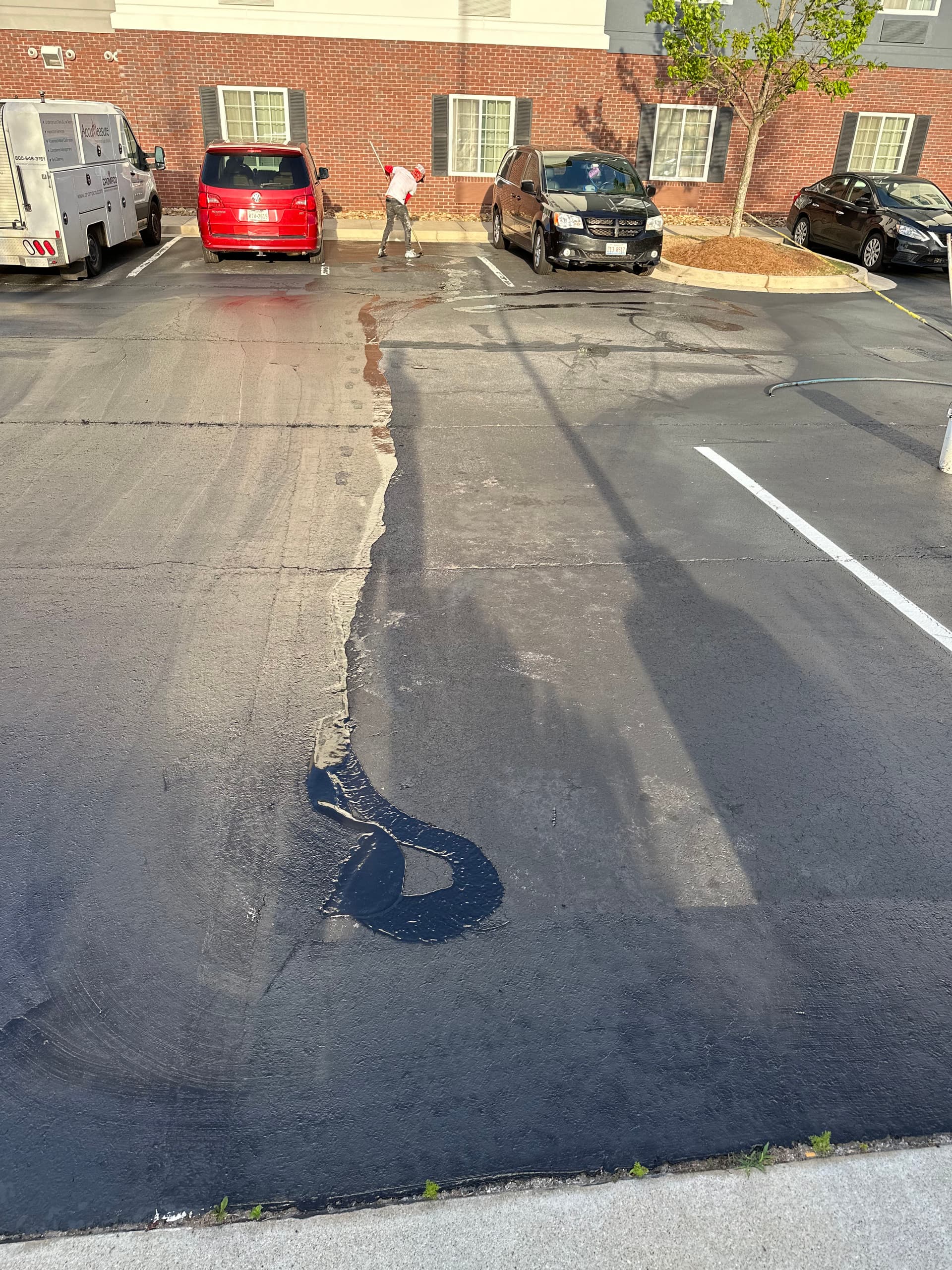 Hotel Parking Lot Sealcoating and Restriping Done Right image